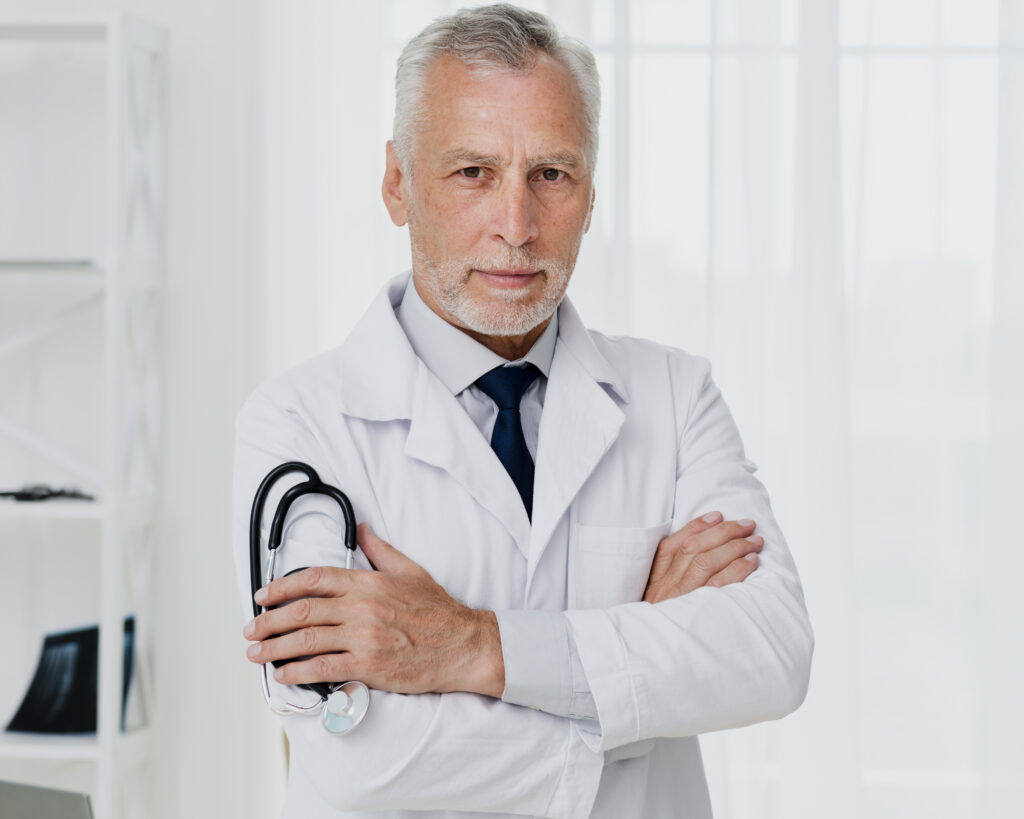 ankylosing spondylitis doctor with white hair standing