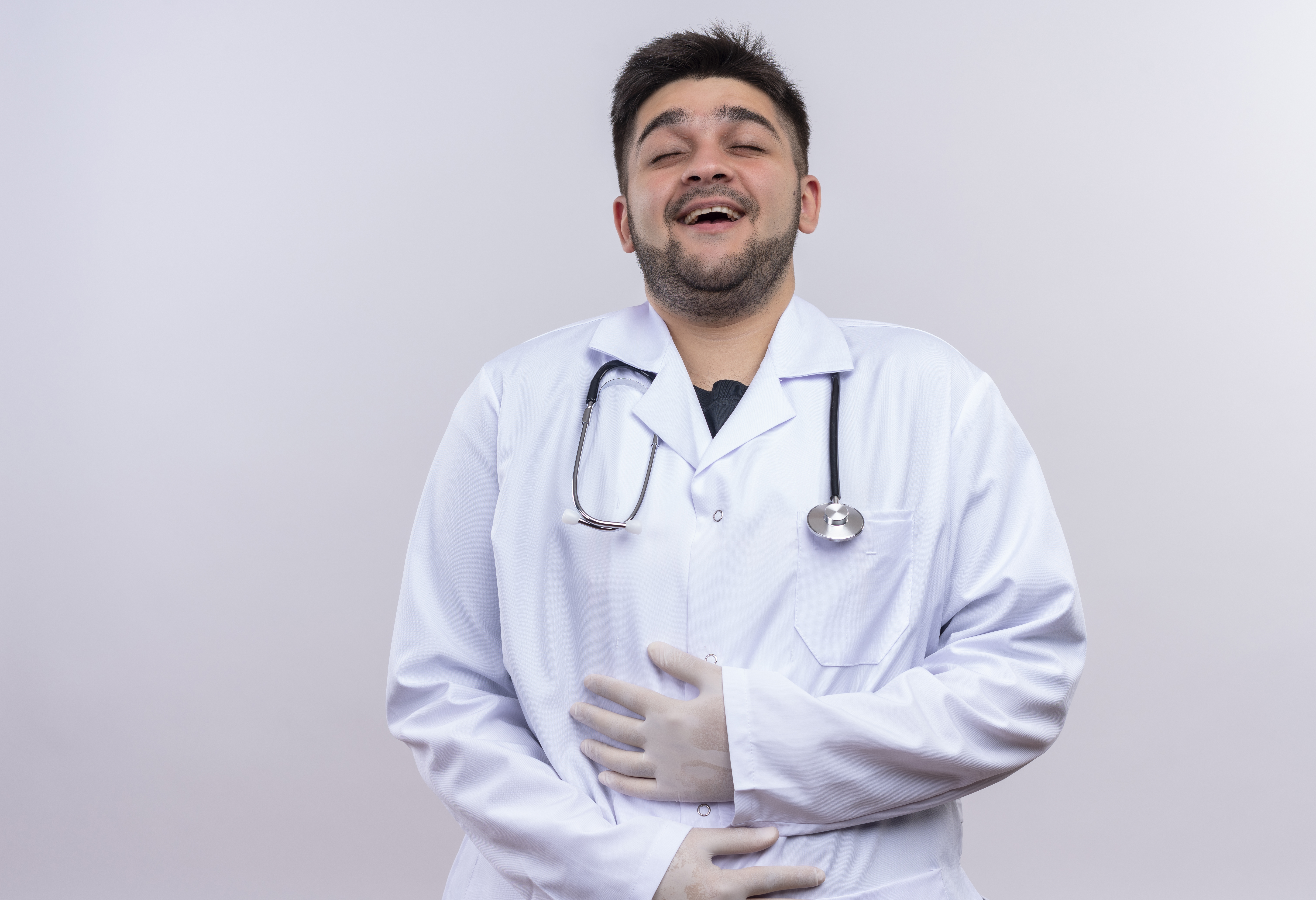 crohns doctor smiling while holding his stomach