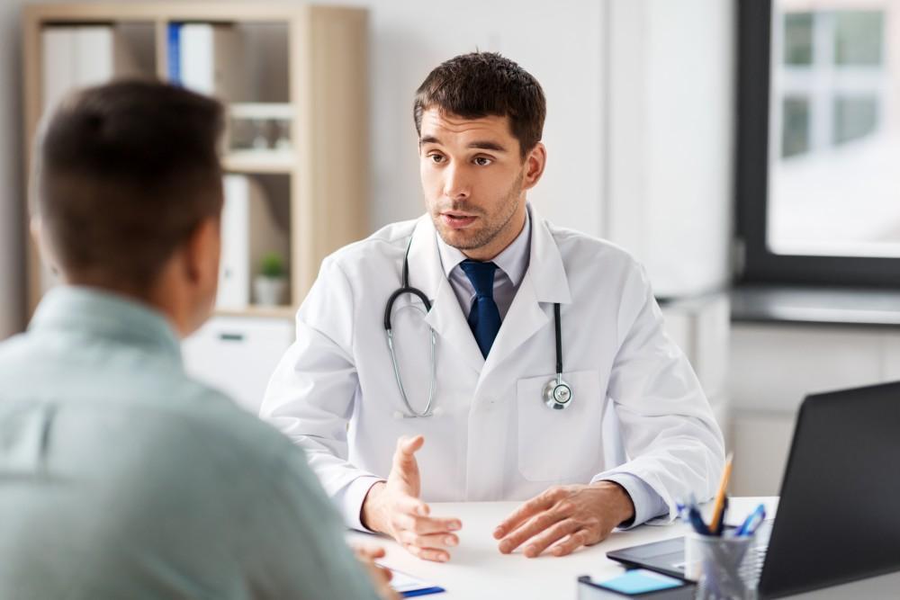 ulcerative colitis male doctor talking to patient